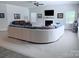 Spacious living room with large sectional sofa, fireplace, and abundant natural light creates an inviting atmosphere at 231 Glenwood Dr # 4, Oakboro, NC 28129