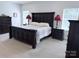Spacious main bedroom with lots of natural light, featuring a large bed and elegant furnishings at 231 Glenwood Dr # 4, Oakboro, NC 28129