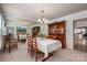 Elegant dining room features a chandelier, large mirror, and dining table for four with built-in cabinets at 2410 Monticello Dr, Gastonia, NC 28056