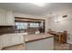Kitchen with white cabinets, granite countertops, and stainless appliances adjacent to the dining area and living area at 2410 Monticello Dr, Gastonia, NC 28056