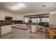 Open concept kitchen with granite counters, white cabinets and appliances adjacent to the living and dining areas at 2410 Monticello Dr, Gastonia, NC 28056