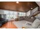 Living room boasts wood accents, large windows, and a cozy atmosphere with view of wooden staircase at 2410 Monticello Dr, Gastonia, NC 28056