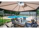 Backyard pool area with a diving board and patio table under a gazebo at 2410 Monticello Dr, Gastonia, NC 28056