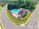 Aerial shot of a community pool area, complete with lounge chairs and well-maintained landscaping at 2476 Glyncastle Way, Gastonia, NC 28056