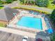Aerial view showcasing a community pool with a variety of lounge chairs and a well-maintained pool area at 2476 Glyncastle Way, Gastonia, NC 28056