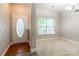 Inviting entryway featuring a decorative door, window, and neutral wall color at 2476 Glyncastle Way, Gastonia, NC 28056