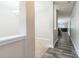 View of open hallway with carpet and hardwood flooring, leading to the living room at 2476 Glyncastle Way, Gastonia, NC 28056