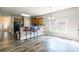 Open kitchen area with bar seating, adjacent dining area, and plenty of natural light at 2476 Glyncastle Way, Gastonia, NC 28056