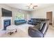Comfortable living room with fireplace, ceiling fan, and ample seating arrangement at 2476 Glyncastle Way, Gastonia, NC 28056