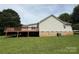 View of back exterior with large deck, siding, and view of the yard at 2511 Old Pond Dr, Lincolnton, NC 28092