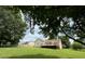 Expansive green backyard featuring a wooden deck and ample space for outdoor activities at 2511 Old Pond Dr, Lincolnton, NC 28092