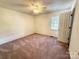 Bedroom with a ceiling fan, bright windows, and neutral carpet at 2511 Old Pond Dr, Lincolnton, NC 28092