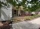 Inviting front porch with brick steps leading up to a cozy outdoor seating area at 2511 Old Pond Dr, Lincolnton, NC 28092