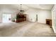 Open-concept living room features a seamless flow to the kitchen and a cozy connection to the outdoor patio at 2511 Old Pond Dr, Lincolnton, NC 28092