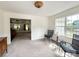 Bright living room with plush carpeting, natural light, and neutral color scheme at 2511 Old Pond Dr, Lincolnton, NC 28092