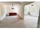 Bright, carpeted living room featuring a dining space and adjacent seating area with natural light at 2511 Old Pond Dr, Lincolnton, NC 28092