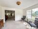Bright living room with plush carpeting, natural light, and neutral color scheme at 2511 Old Pond Dr, Lincolnton, NC 28092