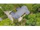 A panoramic aerial view features the backyard with a patio and manicured yard at 307 Dogwood Dr, Mount Holly, NC 28120