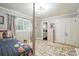 Well-lit bedroom with neutral walls, a plush area rug, and a cozy twin bed with a patterned bedspread at 307 Dogwood Dr, Mount Holly, NC 28120