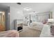 Bright bedroom with a four poster bed, sofa, fireplace, and ample space at 307 Dogwood Dr, Mount Holly, NC 28120