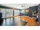 Bonus room with dark walls, light floor, lots of space, and lots of natural light at 307 Dogwood Dr, Mount Holly, NC 28120