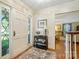 Welcoming foyer with hardwood floors, leaded glass and stylish console table at 307 Dogwood Dr, Mount Holly, NC 28120