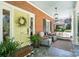 Charming front porch with seating area and a porch swing that invites relaxation at 307 Dogwood Dr, Mount Holly, NC 28120