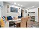 Kitchen banquette with breakfast nook, cushioned seating, and decorative wall hangings at 307 Dogwood Dr, Mount Holly, NC 28120