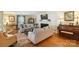 Spacious living room showcasing hardwood floors, fireplace, and comfortable furniture at 307 Dogwood Dr, Mount Holly, NC 28120