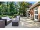 Relaxing outdoor patio with wicker furniture, perfect for entertaining guests at 307 Dogwood Dr, Mount Holly, NC 28120