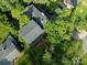 Aerial view of the house surrounded by mature trees and a large backyard at 310 25Th Nw Ave, Hickory, NC 28601