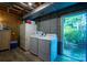 Basement laundry area with washer, dryer, and additional refrigerator at 310 25Th Nw Ave, Hickory, NC 28601