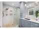 Modern bathroom features a glass enclosed shower with a pebble floor and a vanity with marble countertop at 310 25Th Nw Ave, Hickory, NC 28601