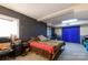 Bedroom featuring a colorful quilt and a black accent wall at 310 25Th Nw Ave, Hickory, NC 28601