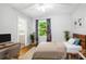 Cozy bedroom featuring a window, desk, hardwood floors and neutral decor at 310 25Th Nw Ave, Hickory, NC 28601