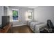 Neutral-toned bedroom featuring hardwood floors, natural lighting, and a window view at 310 25Th Nw Ave, Hickory, NC 28601