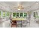 Sunroom dining area with ceiling fan, lots of windows and light, and string lights at 310 25Th Nw Ave, Hickory, NC 28601