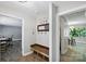 Home entryway with bench, coat hooks, mirror, and views into office and dining room at 310 25Th Nw Ave, Hickory, NC 28601