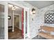 Welcoming entryway with a red front door, bench, and a coat rack offers an inviting atmosphere at 310 25Th Nw Ave, Hickory, NC 28601
