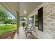 Inviting front porch with brick accents, features two chairs, and offers relaxing outdoor space at 310 25Th Nw Ave, Hickory, NC 28601