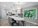 Bright eat-in kitchen featuring stainless steel appliances, grey cabinets, a large window, and a center island at 310 25Th Nw Ave, Hickory, NC 28601
