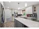 Bright kitchen with stainless steel appliances, pendant lighting, quartz countertops, and a large center island at 310 25Th Nw Ave, Hickory, NC 28601