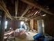 Exposed interior of the home showing beams and insulation ready for completion at 310 E Division Ave, East Spencer, NC 28039