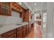 Entertaining bar with custom wood cabinetry, countertop space, and a wine rack provides the perfect space for gathering at 322 Oakview Dr, Salisbury, NC 28146
