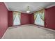 Spacious bedroom with neutral carpet, bright windows, and simple decor offers a peaceful retreat at 322 Oakview Dr, Salisbury, NC 28146