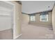 Bedroom features carpet, closet, and two windows for plenty of light at 322 Oakview Dr, Salisbury, NC 28146