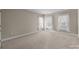 Neutral bedroom featuring carpet and three windows allowing for natural light at 322 Oakview Dr, Salisbury, NC 28146
