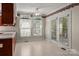 Bright breakfast nook with access to the outside features natural light, neutral flooring, and classic wallpaper at 322 Oakview Dr, Salisbury, NC 28146