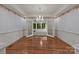 Dining room featuring hardwood floors, decorative wallpaper, and chandelier at 322 Oakview Dr, Salisbury, NC 28146