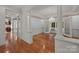 Elegant dining room with hardwood floors, decorative columns, and a chandelier at 322 Oakview Dr, Salisbury, NC 28146